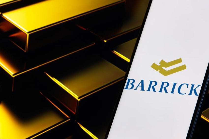 Barrick log on phone beside a gold bar.