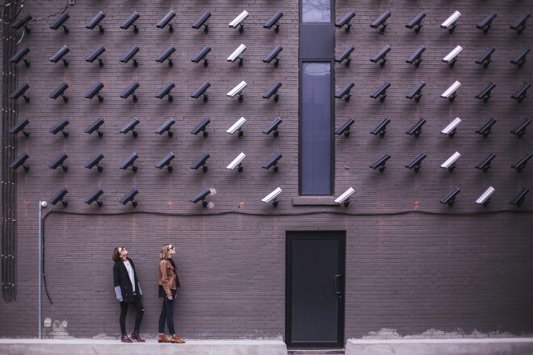 Two Person Standing Under Lot of Bullet Cctv Camera - Max Shestov article